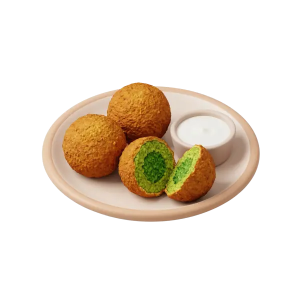 Top-down shot of a beige ceramic plate holding four golden-brown falafel balls, one halved to reveal a bright green herbaceous interior, with a small white dipping bowl of yogurt sauce against a black background.
