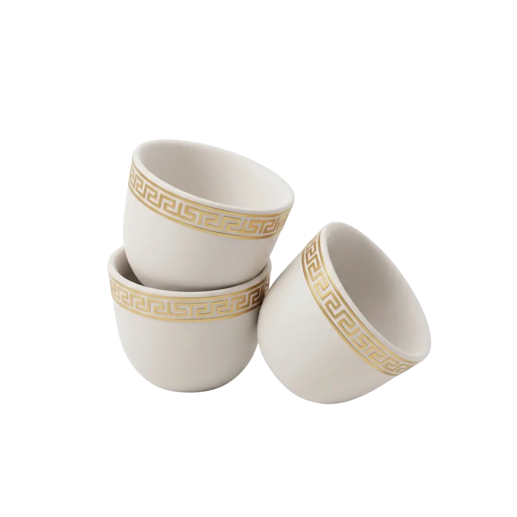 3D render of three white ceramic finjan-style coffee cups with a gold Greek-key decorative band around the rim and a smooth matte-satin finish. Isolated on a black background.