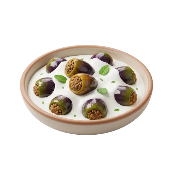 Top-down shot of a ceramic bowl filled with small stuffed eggplants sitting in a creamy white yogurt sauce; glossy purple-green eggplants show spiced ground-meat and rice filling and are garnished with small mint leaves on a black isolated background.