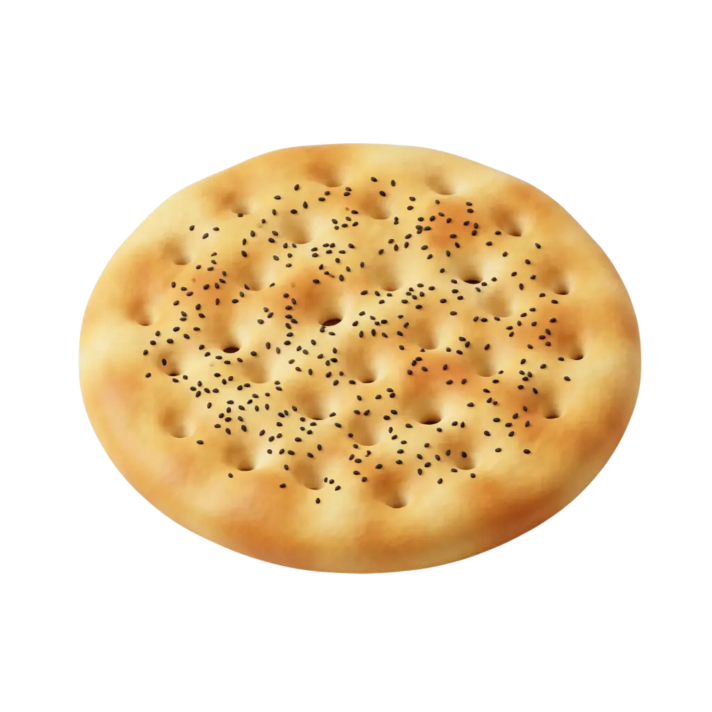 Top-down shot of a round tamees flatbread dotted with black nigella (habbat al‑barakah) seeds, showing a golden-browned surface with dimples and soft crumb texture on an isolated black background.